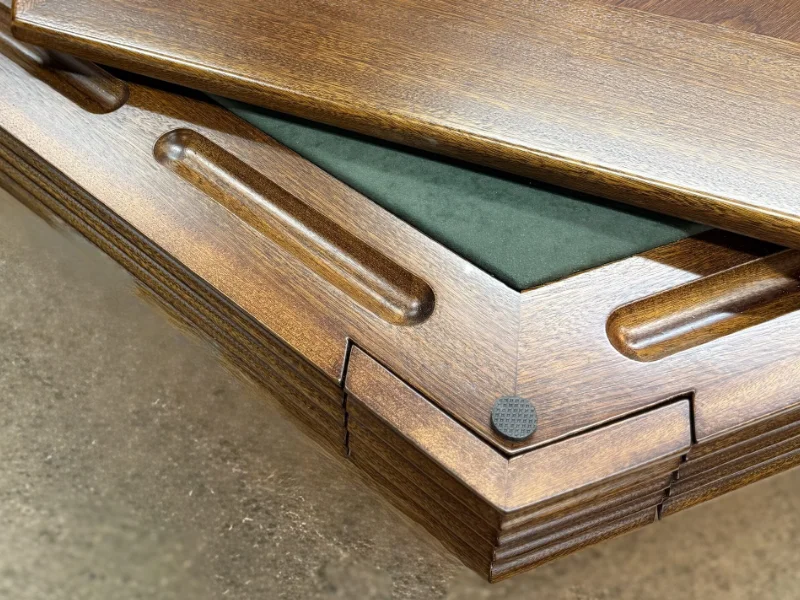 Walnut top sliding off, revealing felt beneath